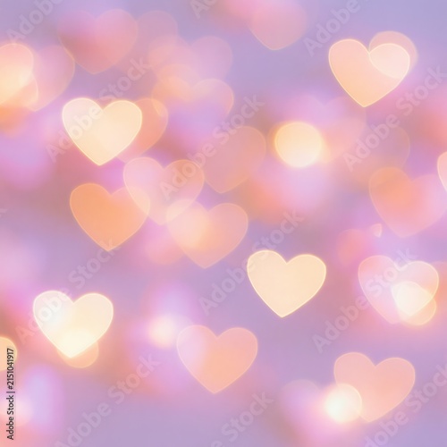 Defocused heart bokeh in soft lavender and cream tones, creating a dreamy background effect suitable for romantic themes and celebrations