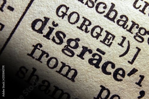 Konstfotografi Word disgrace printed on dictionary page, macro close up.
