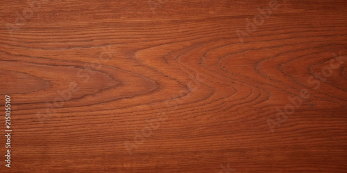 Top view of empty reddish brown cherry or mahogany natural wood grain texture background table surface