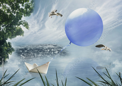 Fotografie A snow-white paper boat floats on the mirror-like surface of the water
