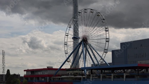 Dolly View Passing Ferris Wheel on Waterfront in Rotterdam