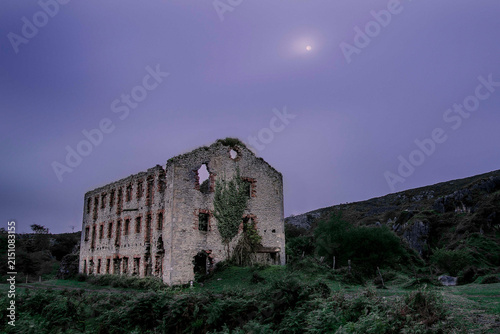 Obraz na plátně Old abandoned mining building ruins under twilight moonlit sky in Triano mountai