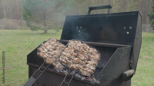 Fresh marinated meat grilling over hot charcoal and open flame
