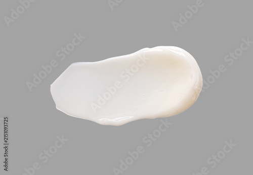 Fotografie White cosmetic cream smear swatch isolated on a neutral light background