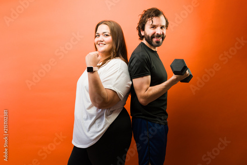 Happy couple starting a fitness journey together, achieving personal health and weight loss goals with determination