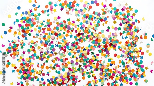 Colorful confetti background scattered on a white surface.