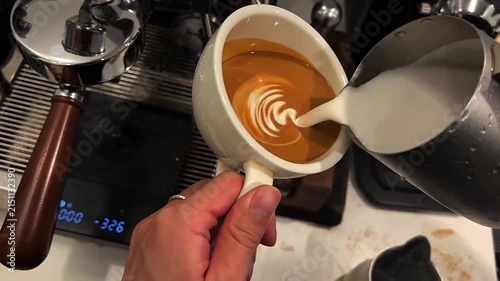 Barista Pouring Steamed Milk to Create Elegant Winged Tulip Latte Art