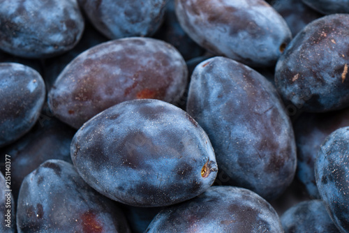 Fresh plums background. Top view. Organic food.