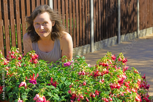 Portrait by the Fuchsia planter.