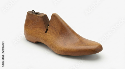 Vintage wooden shoe last, shoemaker's form with metal hinge, isolated on white background