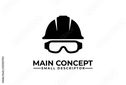 Construction helmet and safety goggles symbolize industrial site safety and worker protection gear.