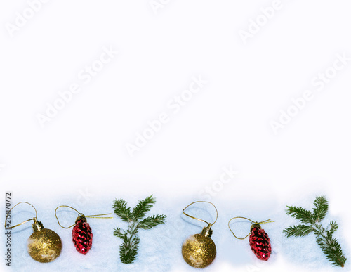 Christmas Ornaments and Fir Branch on Snow Background