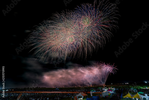 Crowd and food stalls enjoying fireworks festival in Japan