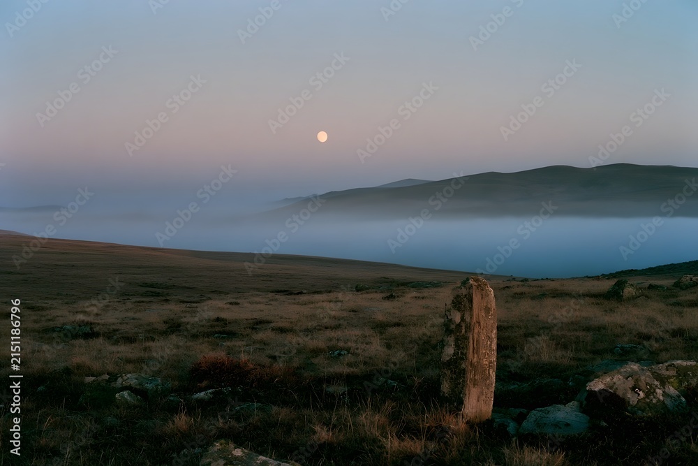Fototapeta premium Alpine tundra at twilight with ground fog and boundary post
