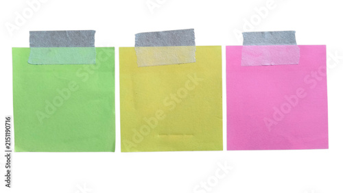 Canvas Print Three colorful square sticky notes in green yellow and pink colors attached with