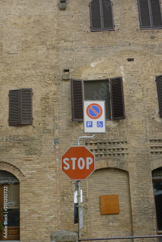 Red Stop Sign and Disabled Parking Traffic Sign