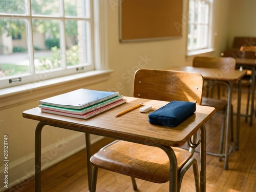Empty Classroom Desk And Chair In A Quiet, Sunlit Educational Setting, Ready For Learning.