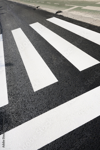 Close-up of a newly painted European zebra crossing.