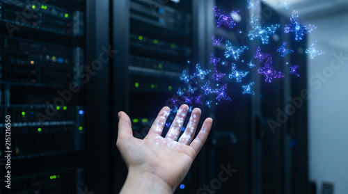 Open hand in dark server room releasing glowing digital butterfly particle AI