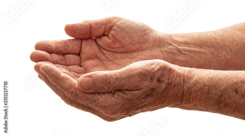 Cupped hands of elderly person extending support with person held on transparent background