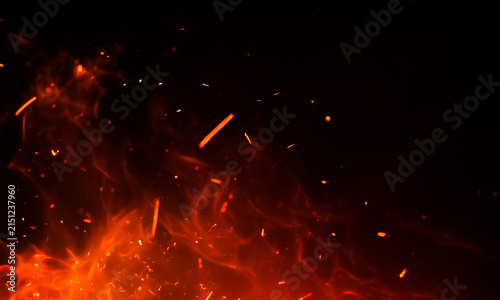 Fiery sparks and embers against a black background dramatic flame texture and glowing particles
