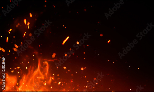 Fiery sparks and flames against a dark background dramatic fire effect with glowing embers
