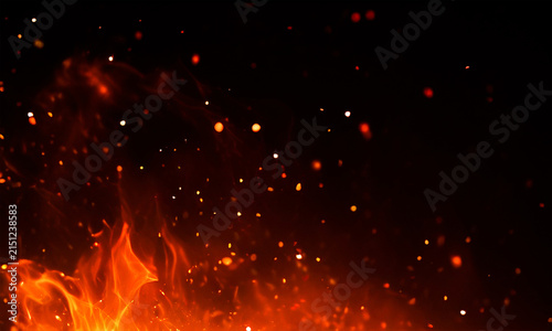 Realistic fire flames and glowing embers on a black background dramatic lighting