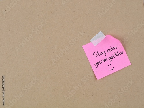 Konstfotografi Motivational handwritten note reading stay calm you've got this on a pink adhesive note taped to a brown cardboard background