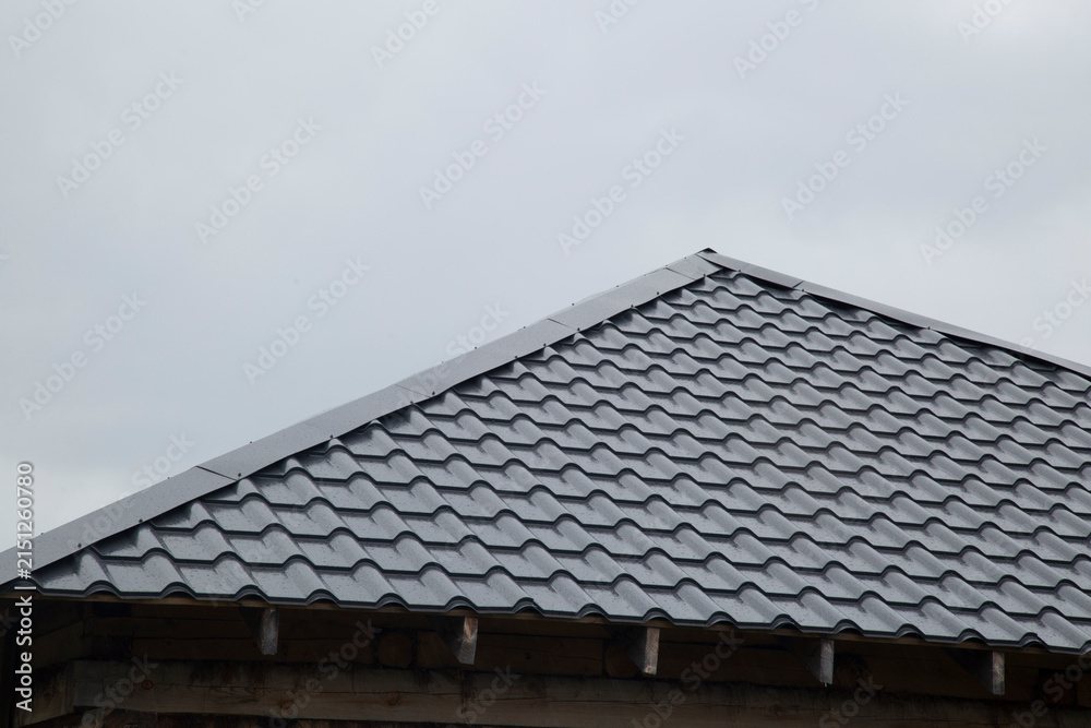 Fototapeta premium Metal tile.Roof for the house. Modern coatings for the roof of the house.
