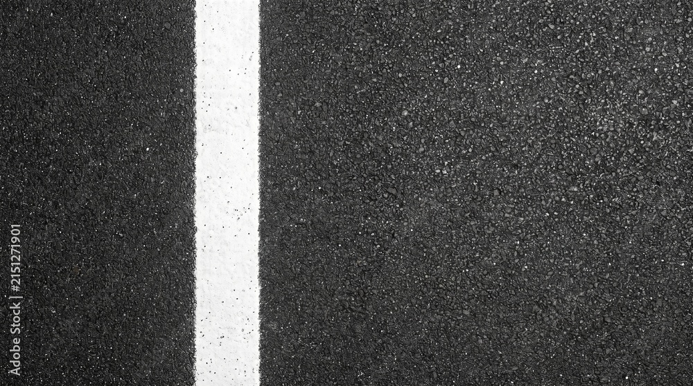 Fototapeta premium Dark asphalt road surface with a clean white line running vertically