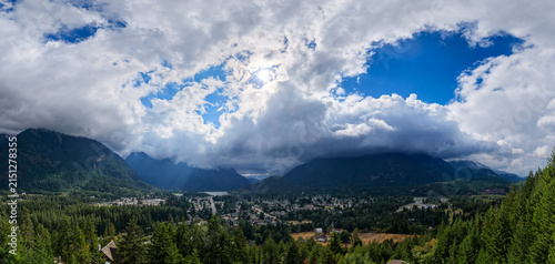 Dramatic Mountain Clouds Over Small Town Valley in Hope British Columbia Canada Panorama