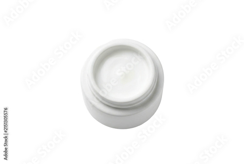 Open white jar with moisturizing face cream top view.