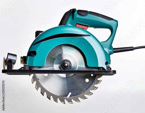 teal electric circular saw against white background