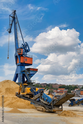 Industrial Harbor Crane and Sand Processing Plant at Riverside Port