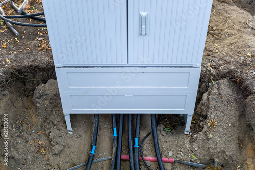 фотографія Underground power cables entering an electrical distribution cabinet during construction work in a residential area in Germany