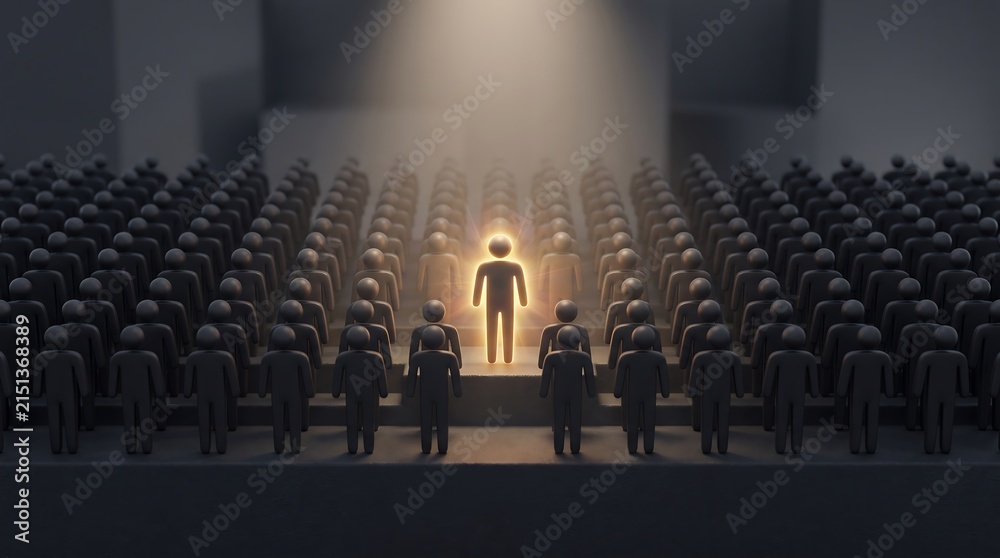 Obraz premium Glowing unique individual standing out from a large crowd of dark silhouettes in auditorium