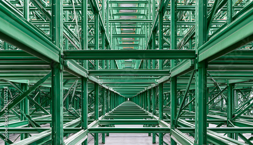 Industrial green metal warehouse racking system, abstract background, storage solutions and logistics