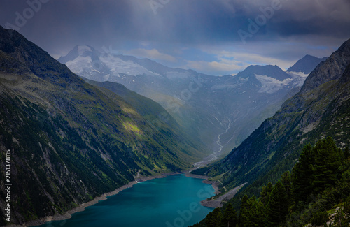 Canvas Print Alpine valley with reservoir in Tyrol mountains Austria