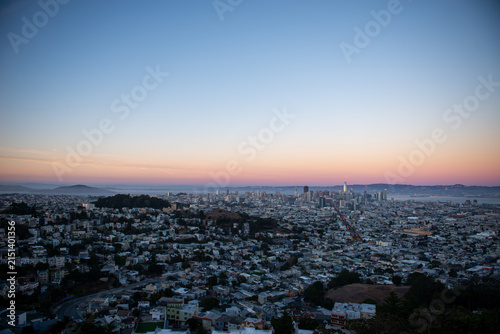Sunset view of San Francisco skyline from a hilltop in California, USA