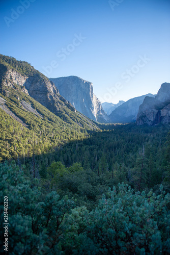Views of Yosemite Valley in California during the day with mountains and trees