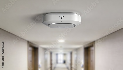 Medium shot of a sleek hallway WiFi access point mounted on the ceiling sharply focused with blurred corridor walls emphasizing seamless guest internet connectivity in hotels.