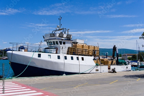 Docked Trawler with Crosswalk in Krk, Croatia on a Sunny Day