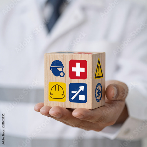 Ukiyo-E Insurance Needle. Concept Of Safety At Work Using A Wooden Cube With Safety Icons