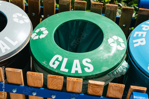 Fotografie Outdoor recycling bins for glass waste, colorful waste separation containers in