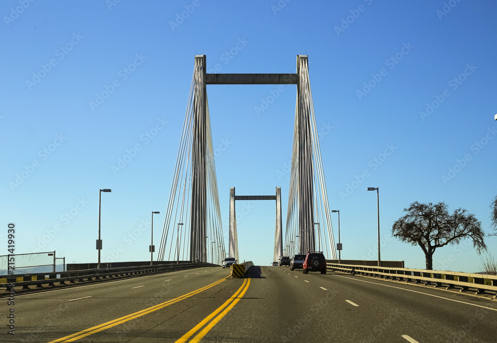 Fototapeta premium Driver view across cable suspension bridge