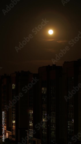 Moon runs over the houses timelapse