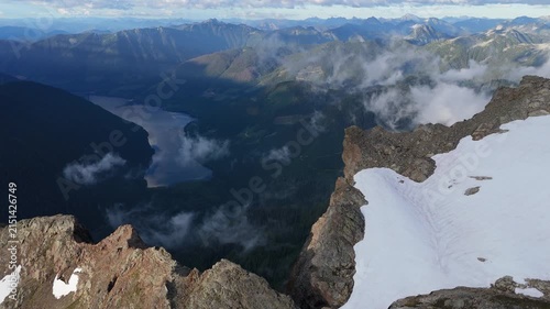 Majestic Mountain Vista Overlooking a Serene Lake and Cloud-Kissed Peaks in British Columbia, Canada