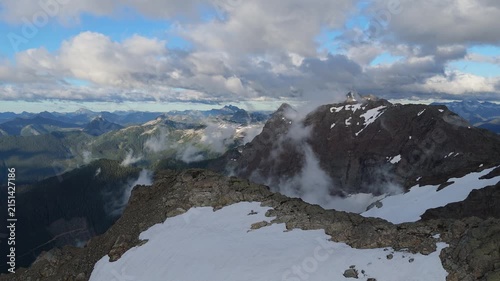 Majestic Mountain Peaks and Rolling Clouds in British Columbia, Canada's Stunning Wilderness