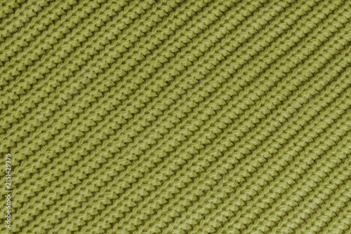 Fotografía Close up, macro of khaki knitted fabric texture with visible diagonal yarn stitches and soft wool pattern