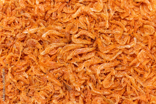 Small orange dried salted shrimp for background, Top view